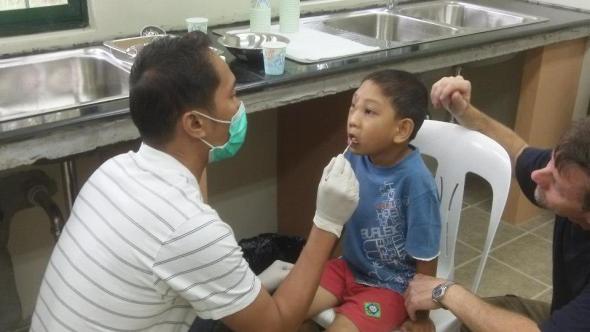 Rehoboth boys tooth checkup at Medical Mission